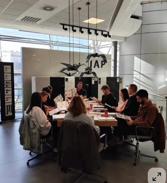 Team in a working session reviewing documents together
